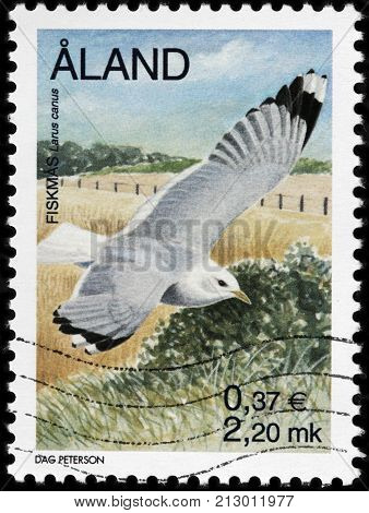 LUGA RUSSIA - AUGUST 20 2017: A stamp printed by ALAND ISLANDS shows Common Gull (Larus canus) circa 2000