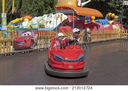 Adler, Sochi, Krasnodar region, Russia - July 13, 2016: Happy kids on attraction the 