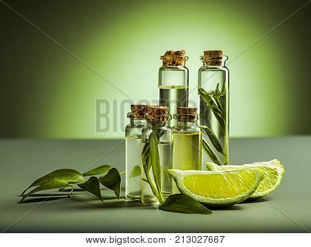 The lime oil on green studio background on table