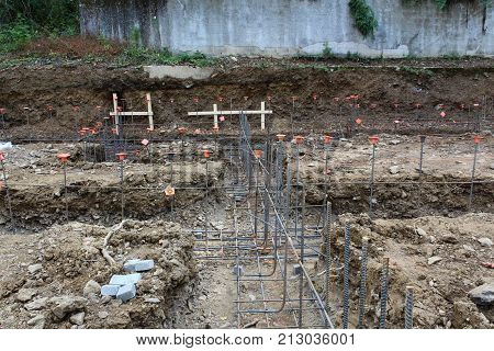 Construction Site View Over Unpoured Footings With Steel Rebar Gridwork, Horizontal View