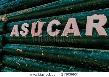 Azucar. A wooden inscription in Spanish meaning 