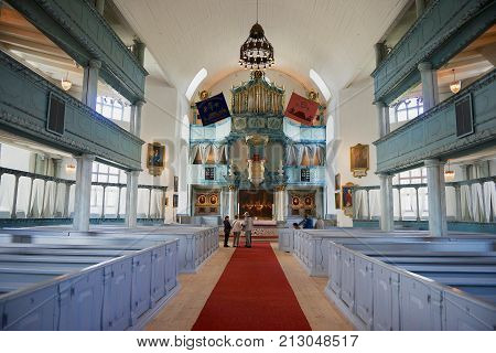 ROROS, NORWAY - JUNE 24, 2013: Unidentified tourists visit Bergstadens Ziir church in the town of Roros, Norway