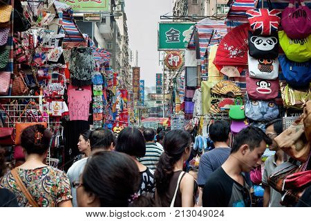MONG KOK, HONG KONG - OCT 1, 2013 - Crowds of shoppers at the Ladies Market in the Mong Kok area of Kowloon, Hong Kong.