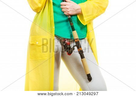 Person Holding Fishing Rod, Spinning Equipment.
