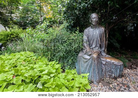 SHANGHAI, CHINA - SEPT 5, 2015 - Statue a famous Chinese writer Rou Shi on Duolun Road, Shanghai. Duolun Road was once home to many well known writers during the 20th century.