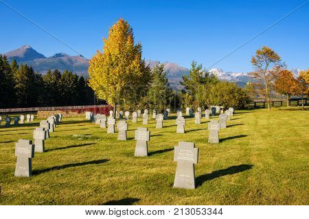 VAZEC, SLOVAKA - OCTOBER 1, 2017 : German military cemetery in autumn with High Tatra mountains in the background and many graves of german soldiers killed in the Second World War.