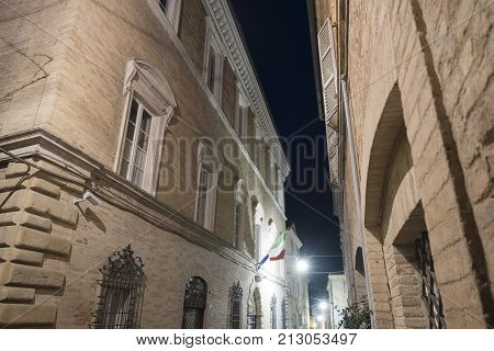 Fermo (Marches Italy): historic buildings along an old typical street at evening.