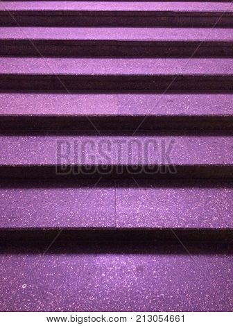 Photo of night stairs with purple steps texture
