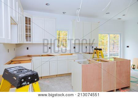 Custom Kitchen Cabinets In Various Stages Of Installation Base For Island In Center