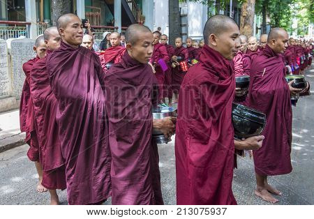 AMARAPURA MYANMAR - SEP 03 : Monks at the Mahagandayon Monastery in Amarapura Myanmaron September 03 2017 Mahagandayon Monastery has 2000 monks at any given time.