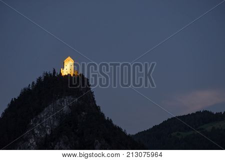 Fortress top of the hill. Castle on the mountain and evening light. Austria Europe