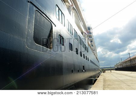 FALMOUTH, JAMAICA - DEC 29, 2014: Holland American Line Cruise ship Zuiderdam anchore offshore in Falmouth, Jamaica. Falmouth port is built by Royal Caribbean Cruise company in 2012.