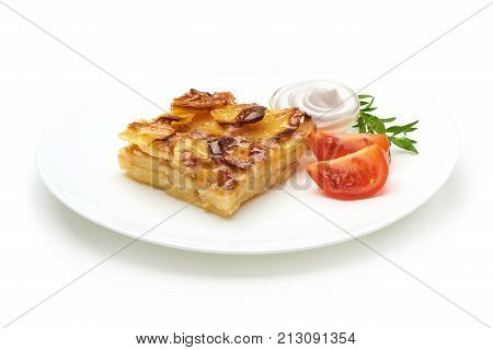 Potato casserole with vegetables, isolated on white background.