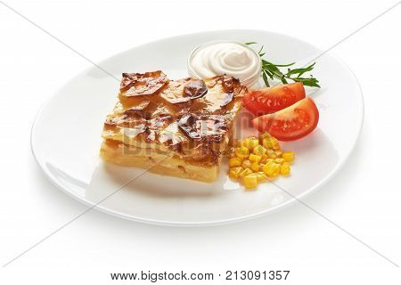 Potato casserole with vegetables, isolated on white background.
