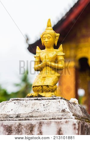 Statue Of A Buddhist Godt, Louangphabang, Laos. Close-up. Vertical.
