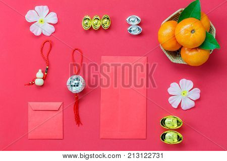 Above view shot of accessories Chinese new year & Lunar festival concept background.Flat lay of arrangement essential items on modern rustic wood red wallpaper.Sign objects for the decor season.