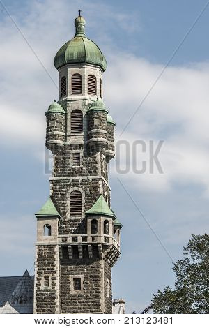 Quebec City, Canada old Church tower steeple Dame Cathedral closeup with cross and windows