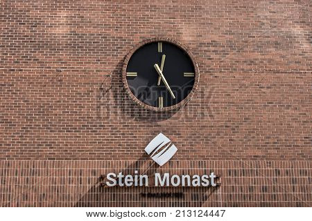 Quebec, Canada 12.09.2017 Vintage Station Clock On A Red Brick Wall at the Stein Monat lawyer building