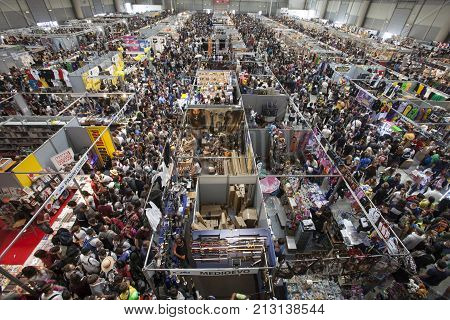 ROME, ITALY. October 4, 2015: Crowd thousands people aerial view. Packed crowded fair. Romics 2015.  Thousands of people flock to the exhibition of comics, cartoons and movies.