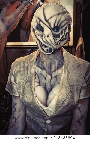 ROME, ITALY. October 3, 2015: Silent hill female doctor. Alien monster. Character of the famous game console. Dr. monster makeup and mask. Cleveage big breasts during Romics 2015 in Rome, Italy.