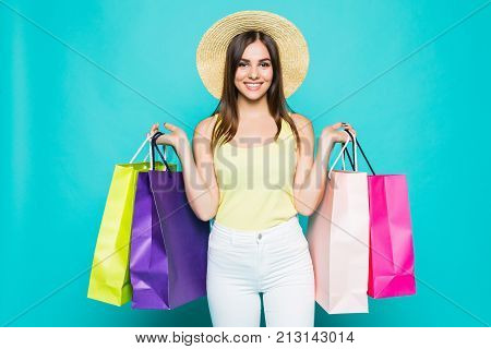 Young Happy Summer Shopping Woman With Shopping Bags Isolated On Color Background