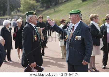 Aubagne, France. May 11, 2012. Veterans of the French foreign legion in green berets and with medals for military merits communicate during the annual meeting of veterans.