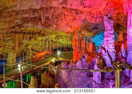 Sfendoni or Zoniana cave on Crete with colorful illumination