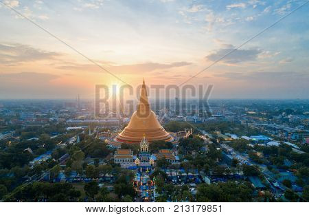 Large golden pagoda Located in the community at sunset Phra Pathom Chedi Nakhon Pathom Thailand .