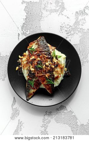 Sicilian style mackerel on cauliflower puree with caramelized onions, pine nuts.