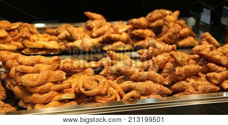 many fragrant brioches and pastries in the bar with a large mirror