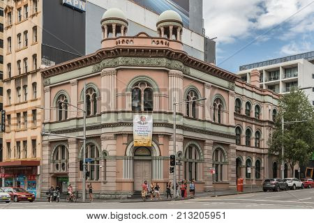 Sydney Australia - March 25 2017: IFGF Christian Sect headquarters and church on corner of George and Regent street near Railway Station is a historic building. Banner of founder Sun Myung Moon.