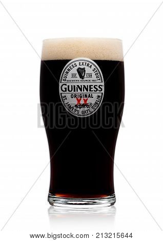 London, Uk - November 10, 2017: Glass Of Guinness Original Beer On White. Guinness Beer Has Been Pro