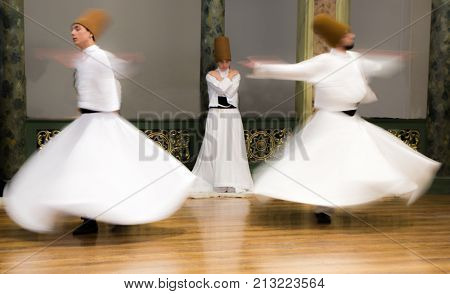 Blurred Whirling Dervishes Practice Their Dance