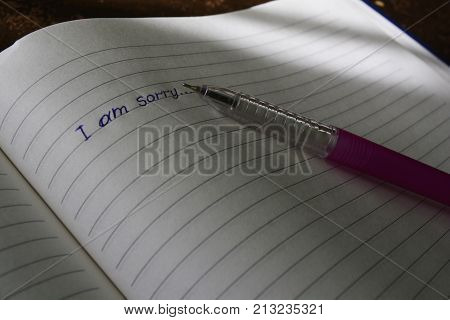 apology on notebook Leith in the line