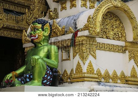 Figure guardian close up Shwedagon Pagoda in Yangon Myanmar (Burma)