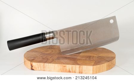 Chinese knife with a cutting board. Front view. White background