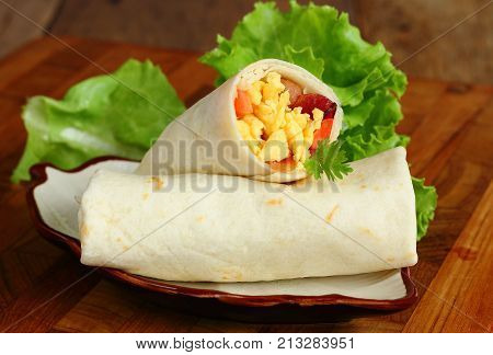 Mexican fast food Burritos wraps with omelet ham.