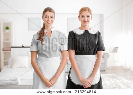 Beautiful chambermaids in room