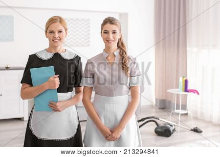 Beautiful chambermaids in room