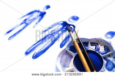 Abstract people made of watercolour  palette and artist brushes