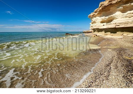 On the shore of the Caspian Sea. Caspian Sea in Kazakhstan.
The Caspian Sea is the largest enclosed inland body of water on Earth by area, variously classed as the world's largest lake or a full-fledged sea.