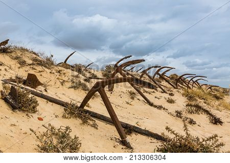 Natural Cemetery Of Marine Anchors At Barril Beach, Portugal