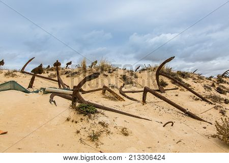 Natural Cemetery Of Marine Anchors At Barril Beach, Portugal