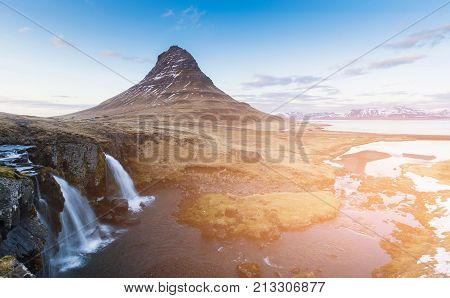 Kirkjufell foss natural volcano with waterfall Iceland nautral winter season landscape background
