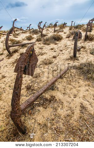 Natural Cemetery Of Marine Anchors At Barril Beach, Portugal