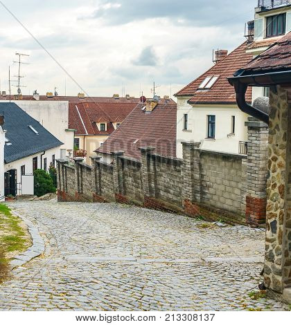 The town of Hluboka nad Vltavou. Medieval town. Narrow streets. Red tiled roofs of houses