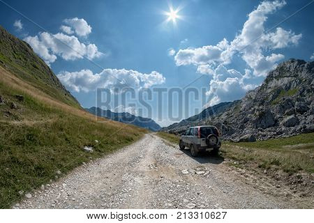LUKAVICA, MONTENEGRO - JULY 20, 2017: off road car on a scenic but rough road of Montenegro Mountain