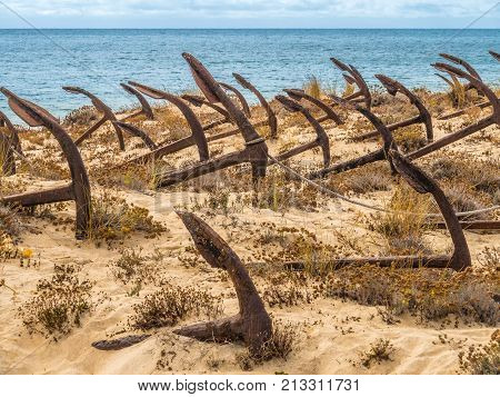 Natural Cemetery Of Marine Anchors At Barril Beach, Portugal