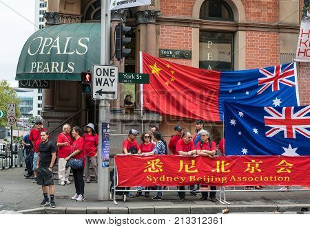 Sydney Australia - March 25 2017: Chinese living in Australia welcome Chinese Premier Li Keqiang in town with banners giant flags and lots of noise at corner of York Street.