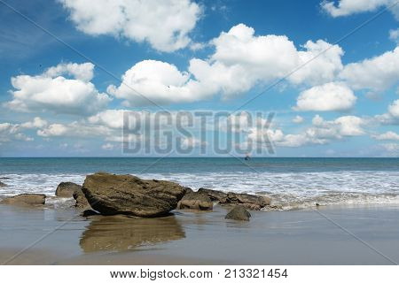View of Mancora Beach in Peru with clouds and blue sky